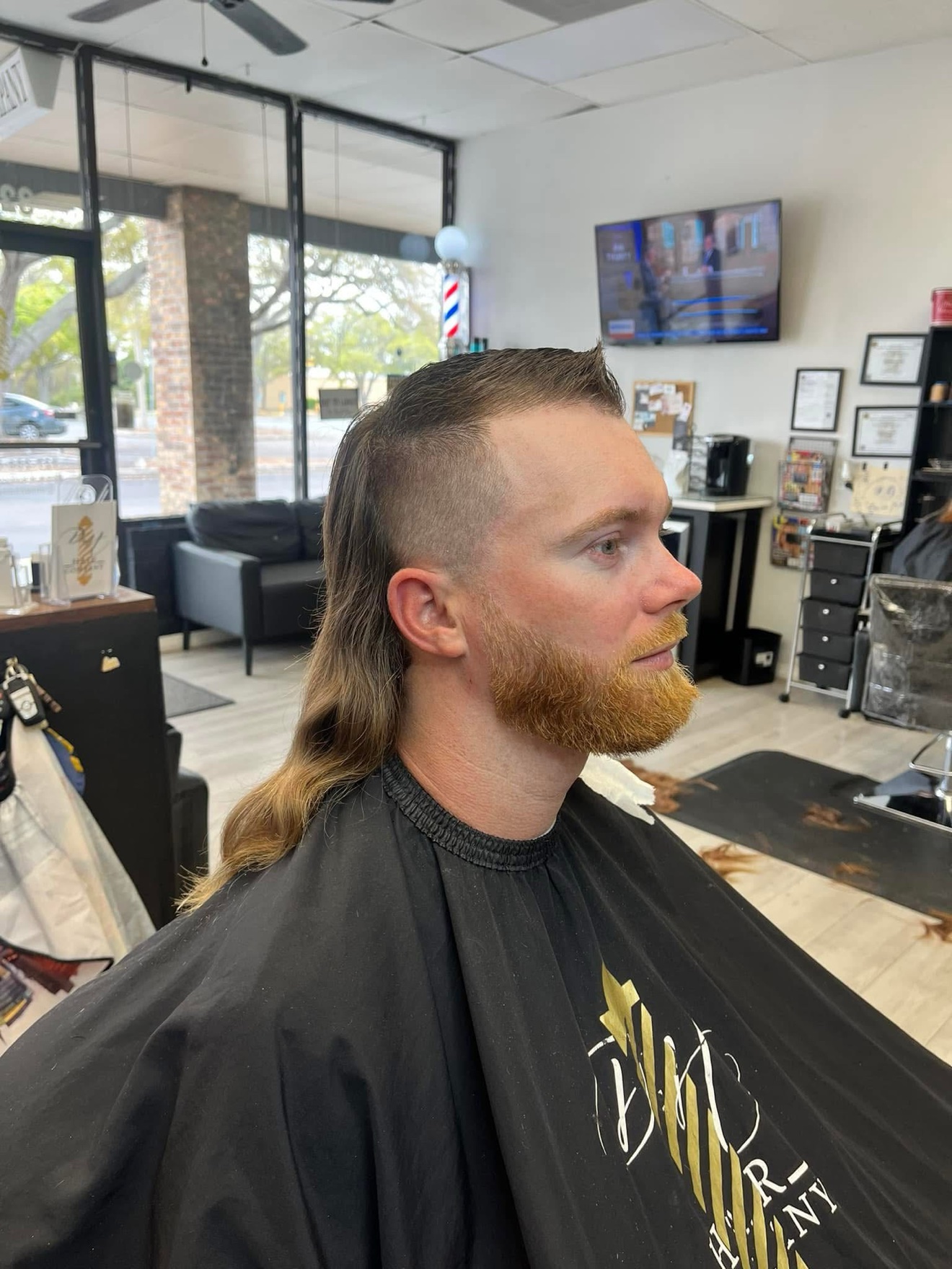 Mullet with a shaped red beard, side view, by Danny at D&H Hair Company