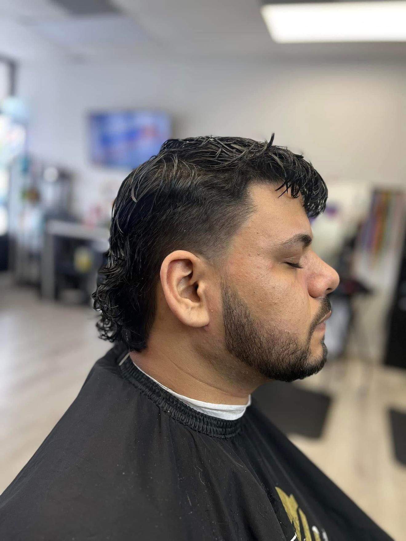 Mullet with a taper fade and shaped beard, side view, by Danny at D&H Hair Company