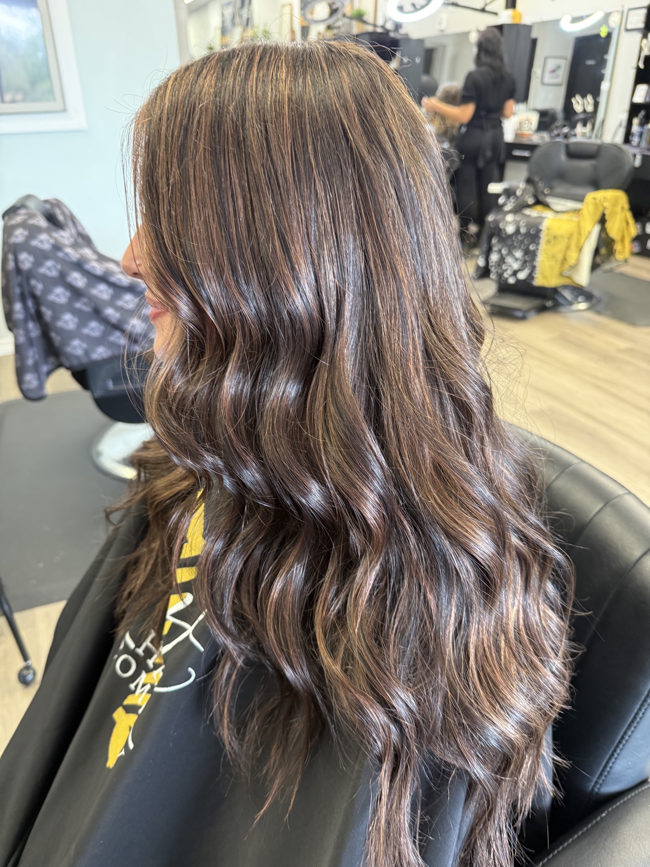 Long glossy dark brown waves, back view, by Heather at D&H Hair Company
