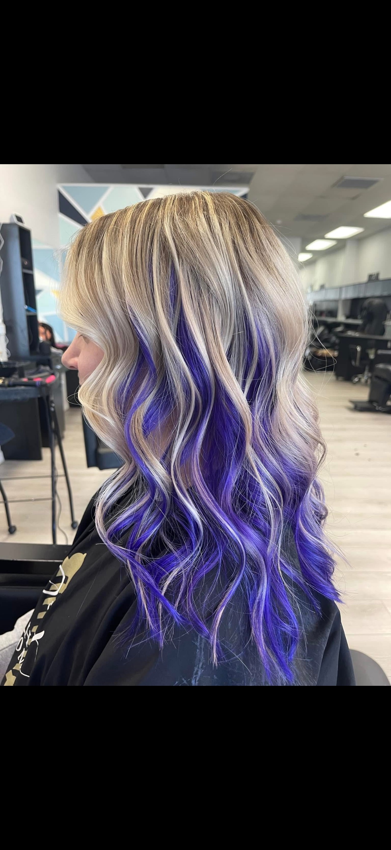 Platinum blonde hair with vivid purple peekaboo color, side view, by Heather at D&H Hair Company
