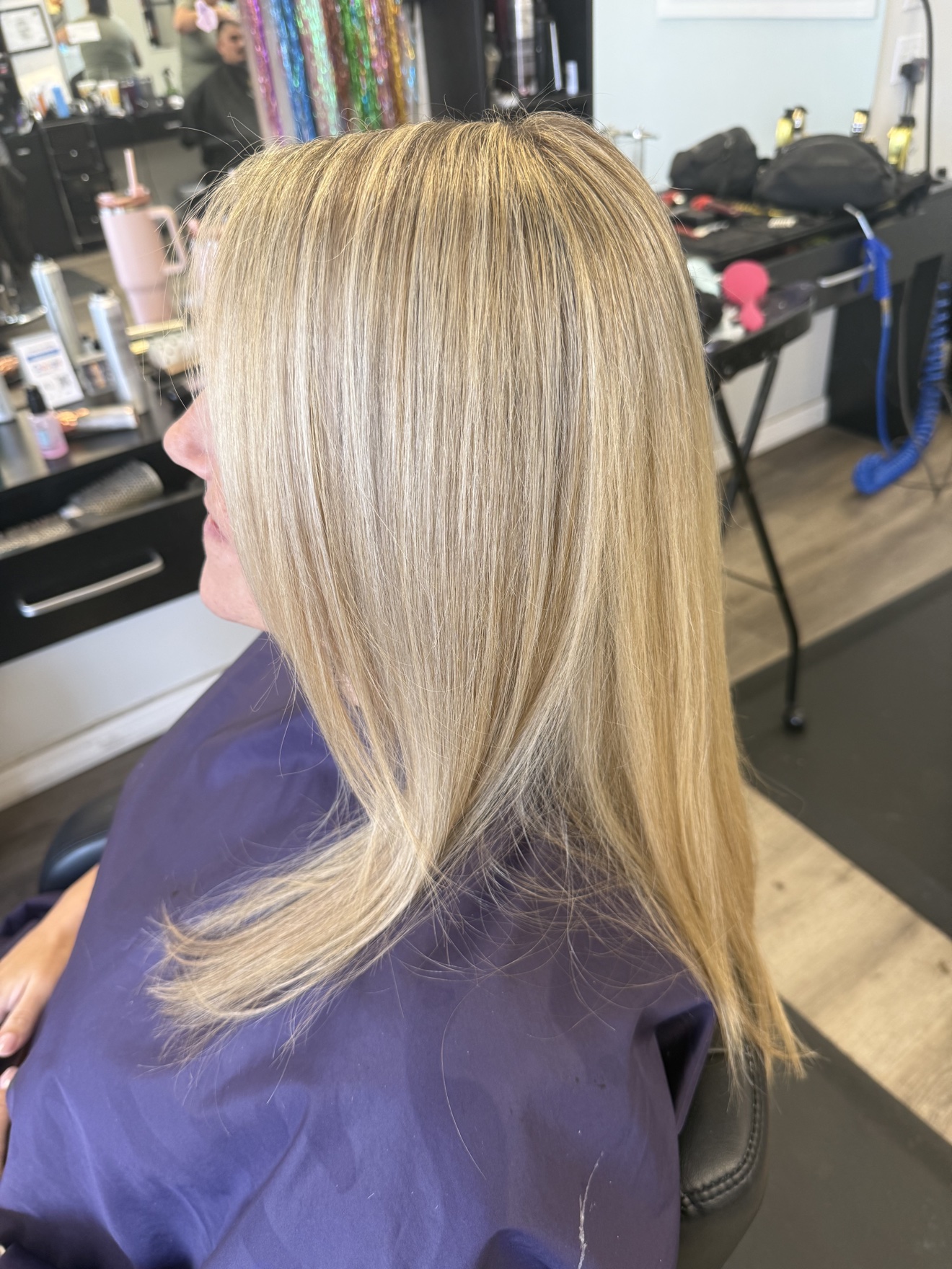 Long layered blonde hair, side view, by Heather at D&H Hair Company