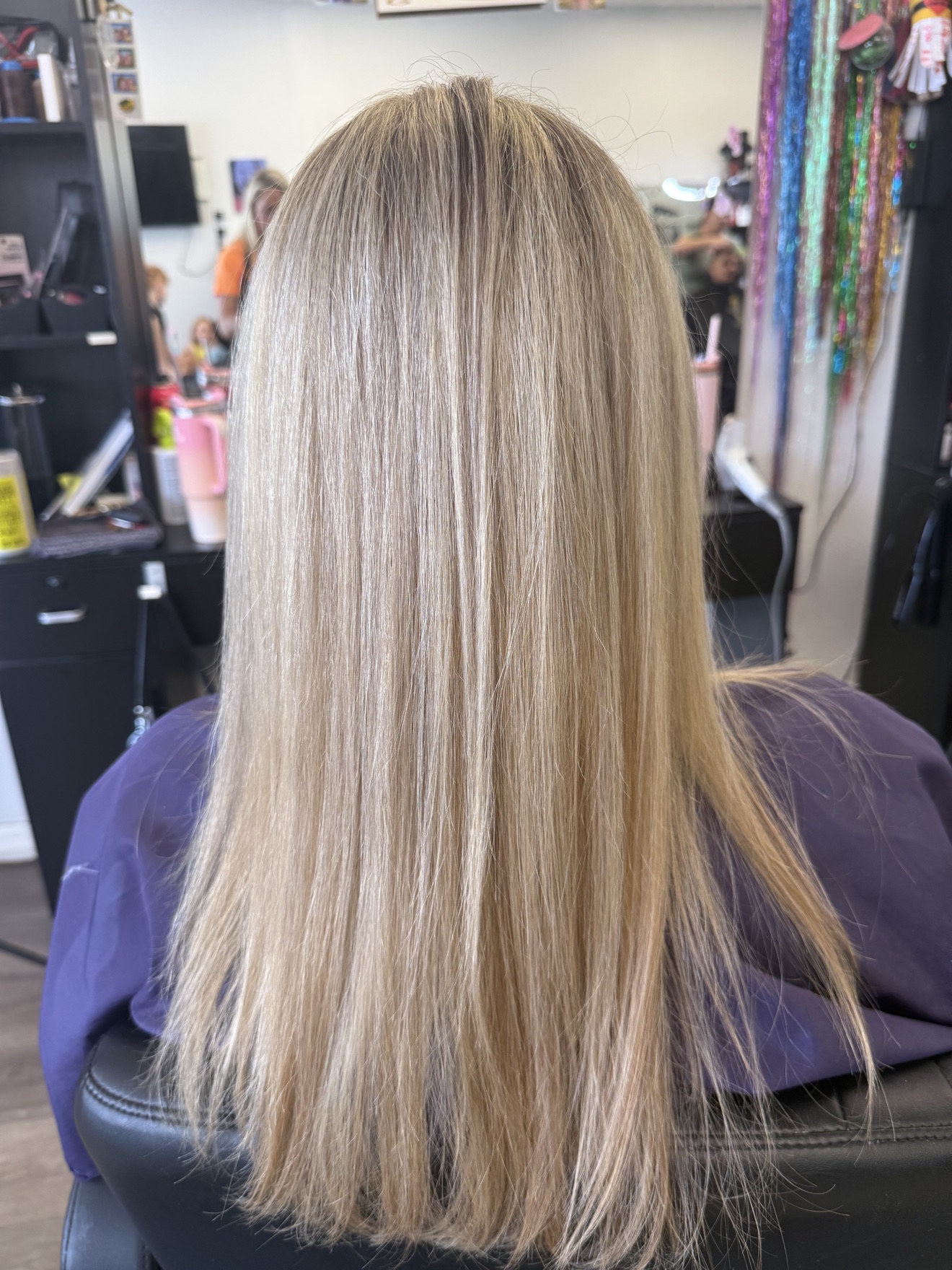 Long straight blonde hair, back view, by Heather at D&H Hair Company