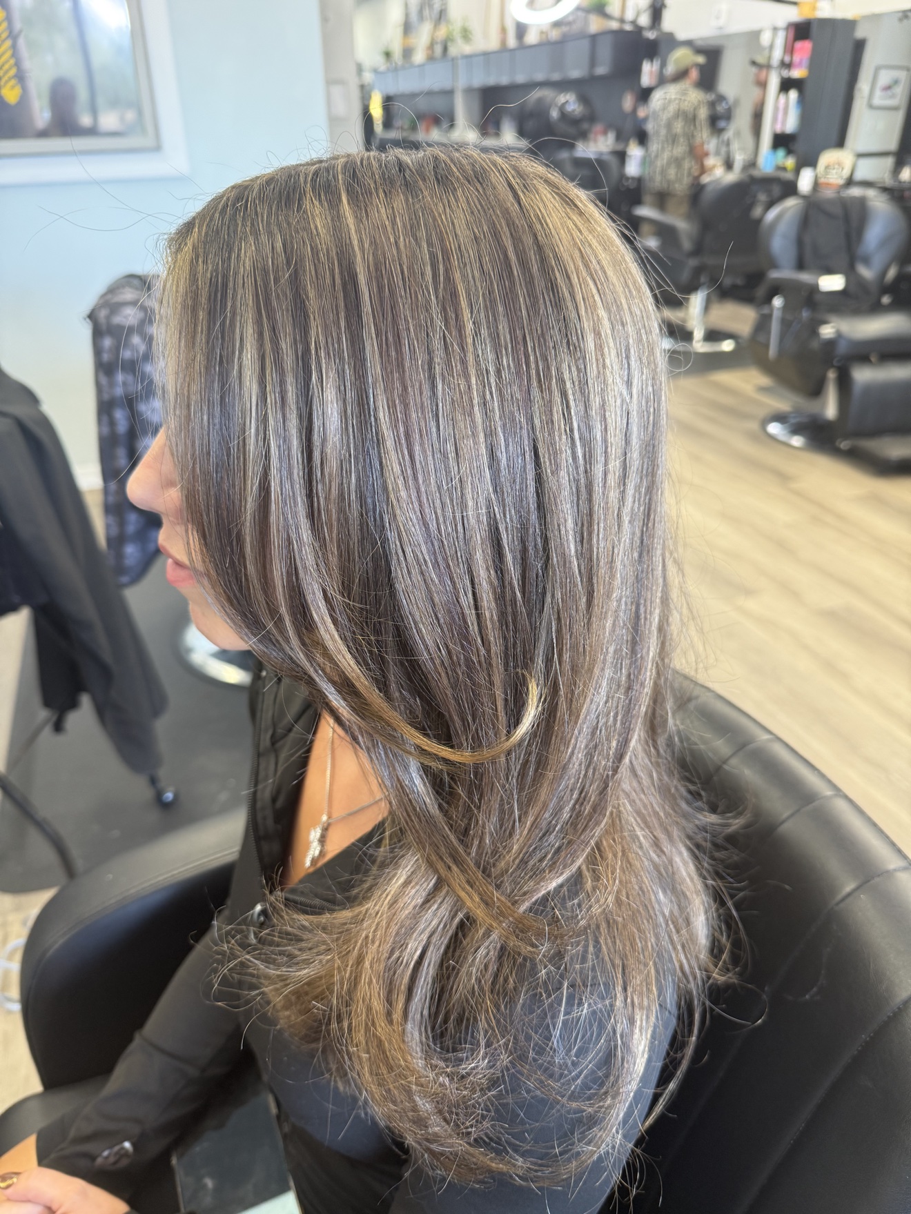 Long brunette hair with ash blonde highlights, side view, by Heather at D&H Hair Company