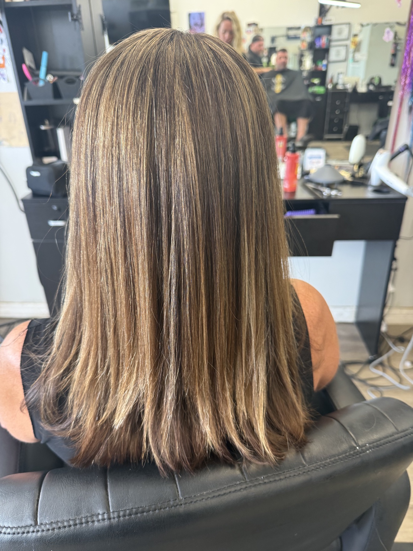 Long brunette hair with caramel highlights, back view, by Heather at D&H Hair Company