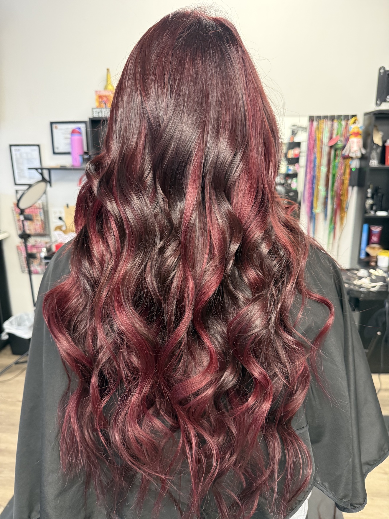 Long burgundy waves, back view, by Heather at D&H Hair Company