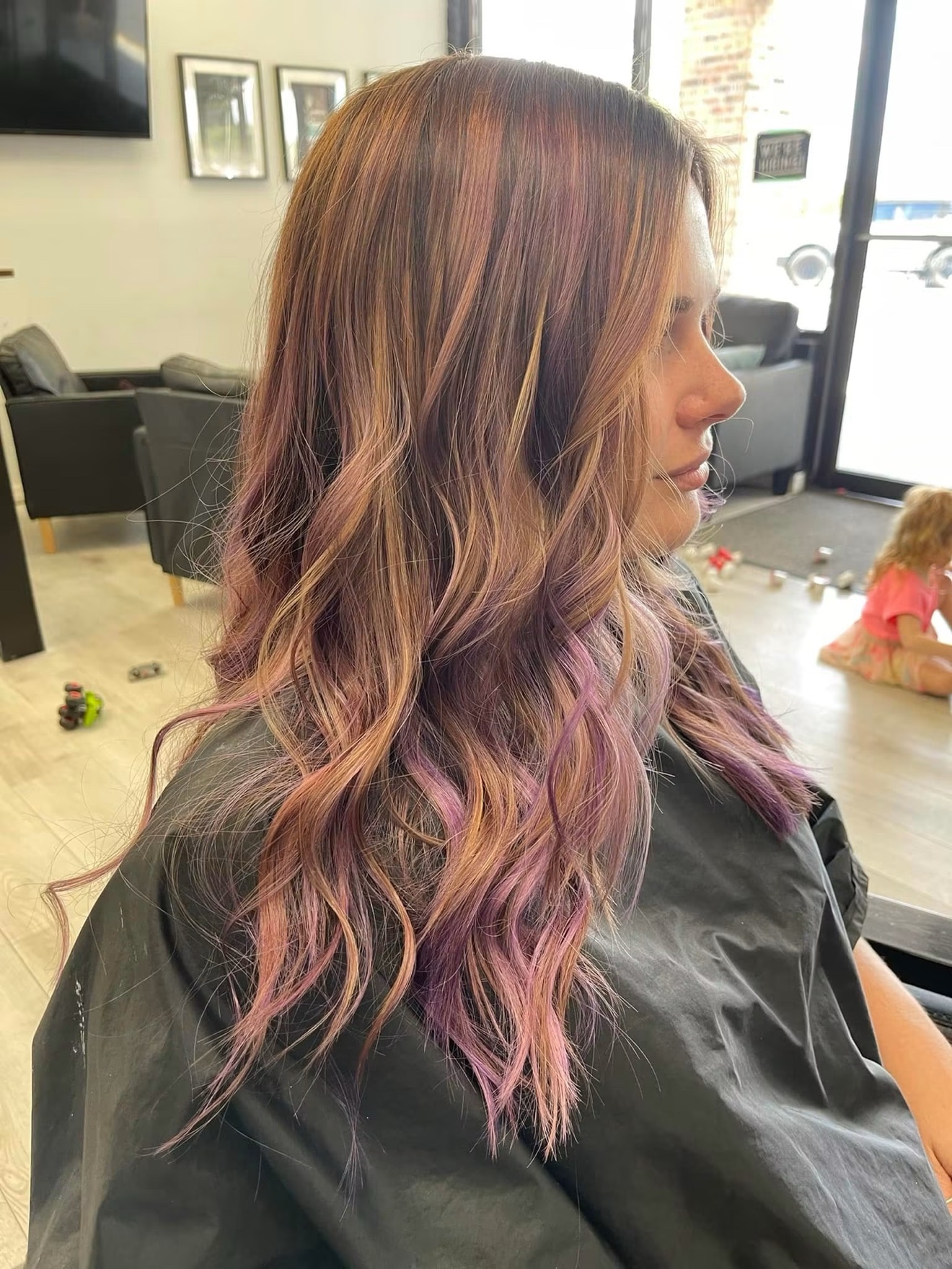 Wavy hair with pink tones, side view, by Heather at D&H Hair Company