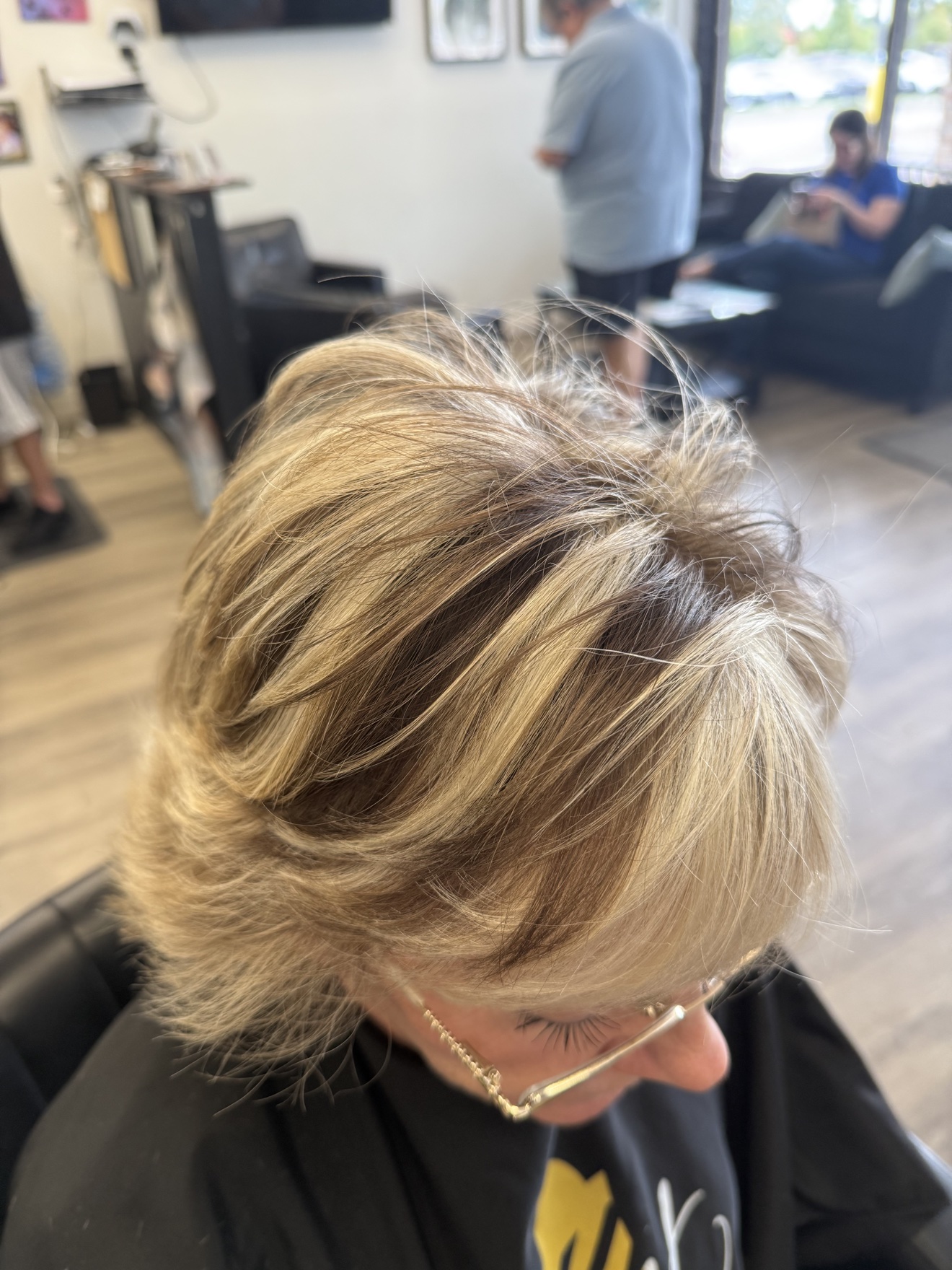 Short layered blonde cut, top view, by Heather at D&H Hair Company