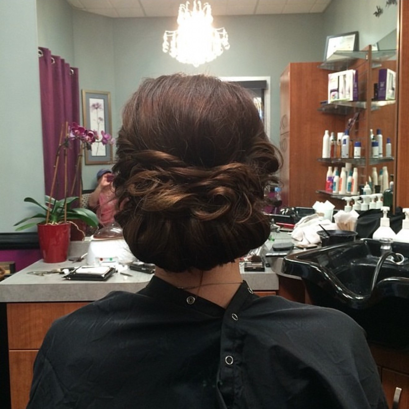 Twisted low bun prom updo, back view, by Heather at D&H Hair Company