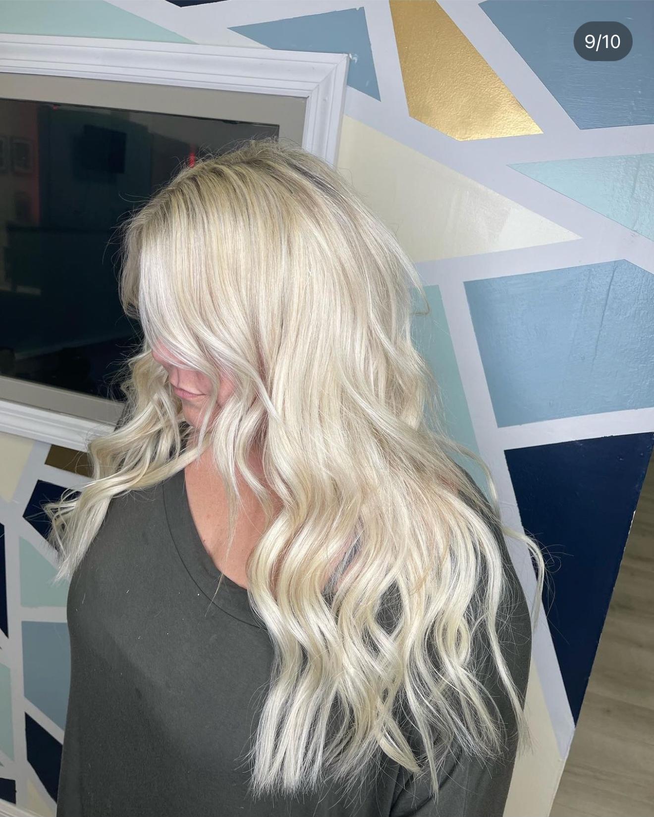 Platinum blonde hand-tied hair extensions with soft waves, side view, by Heather at D&H Hair Company