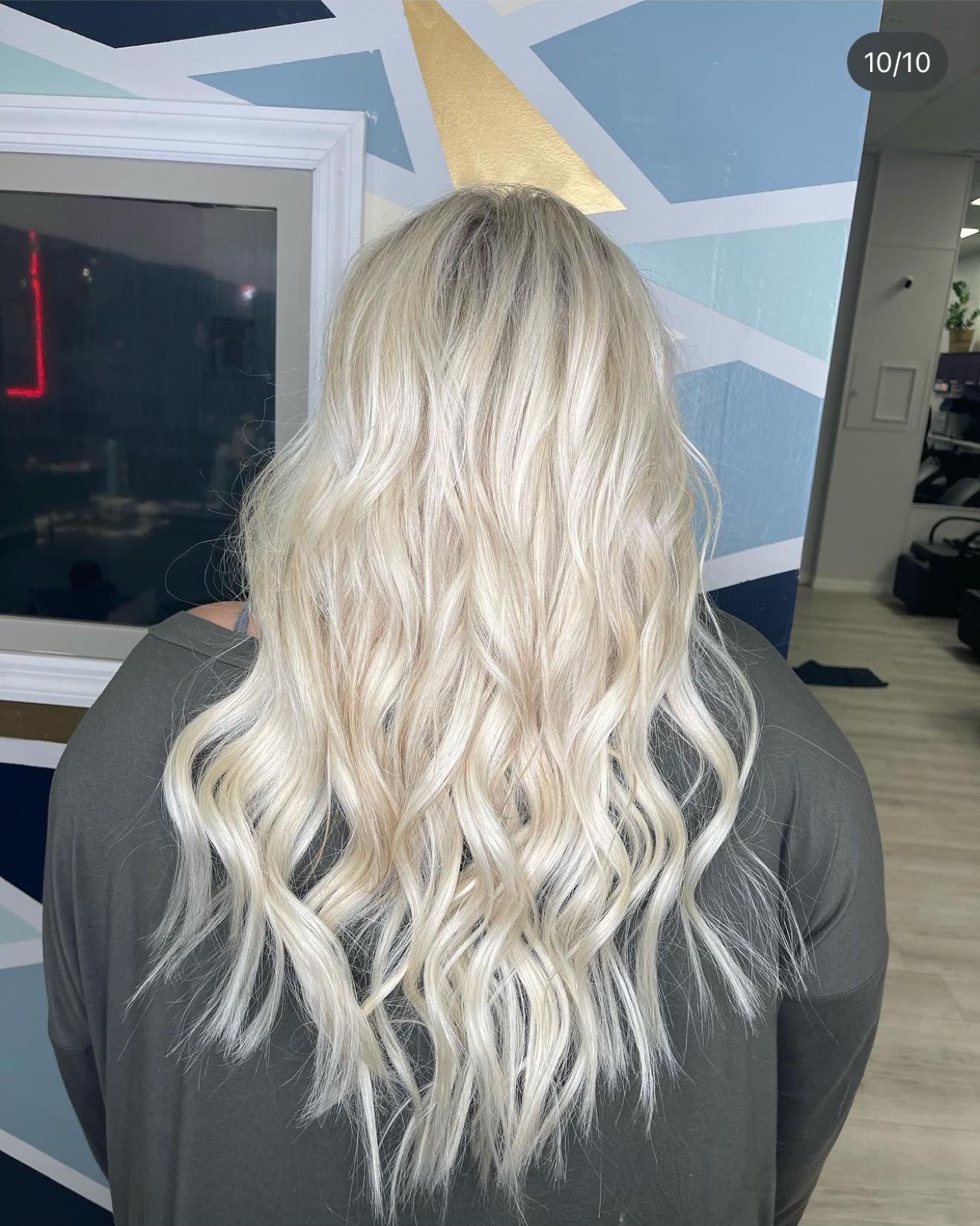 Platinum blonde hand-tied hair extensions with soft waves, back view, by Heather at D&H Hair Company