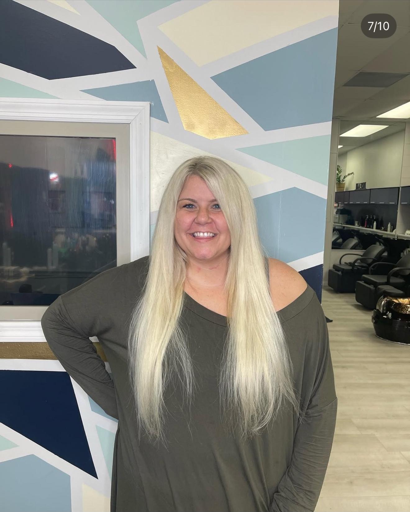 Long platinum blonde hand-tied hair extensions worn straight, front view, by Heather at D&H Hair Company