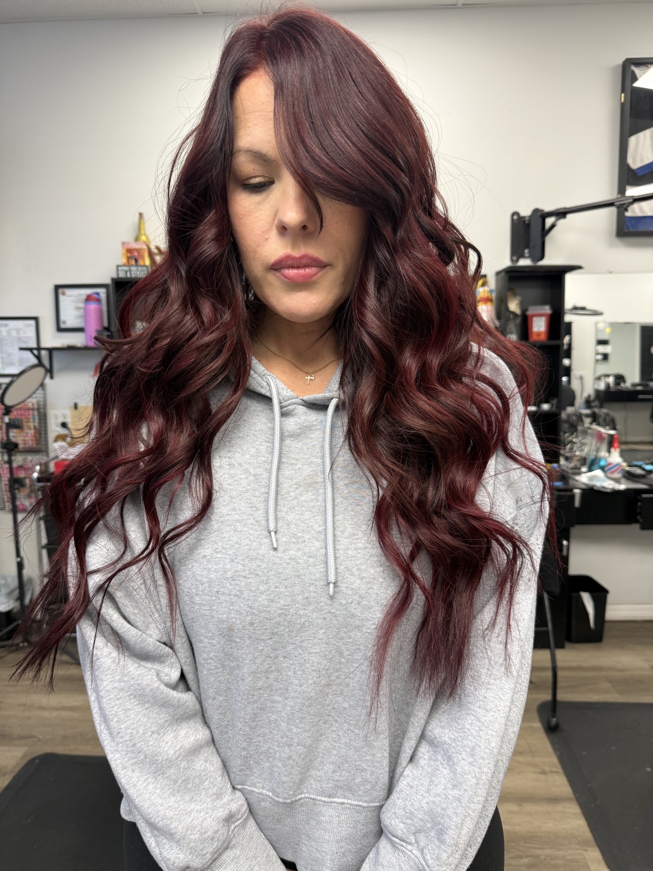 Long burgundy red wavy hair extensions, front view, by Heather at D&H Hair Company