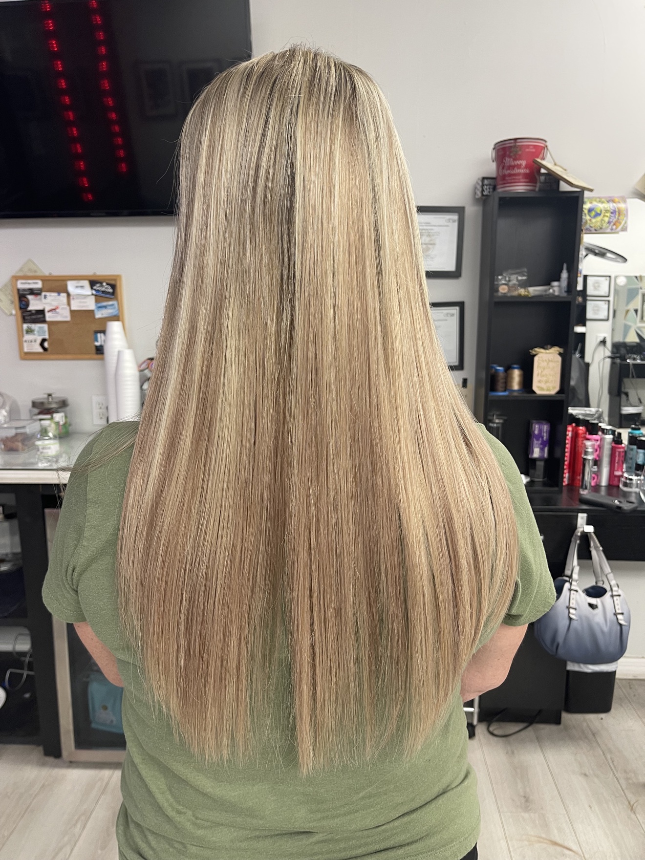 Long straight highlighted blonde hair, back view, by Heather at D&H Hair Company