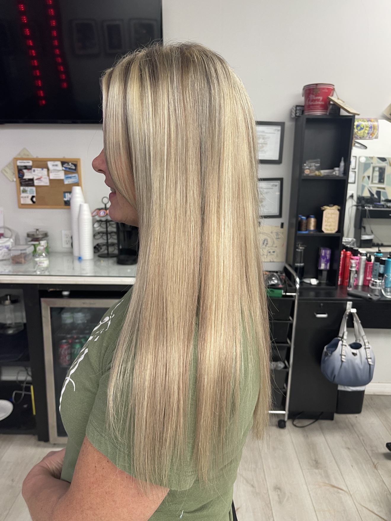 Long straight highlighted blonde hair, side view, by Heather at D&H Hair Company