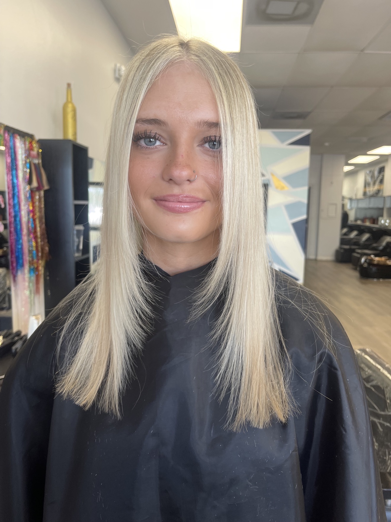 Straight platinum blonde hair, front view, by Heather at D&H Hair Company