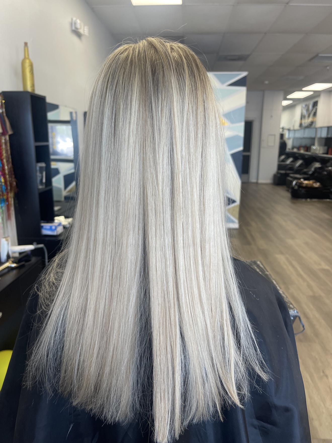 Straight platinum blonde hair, back view, by Heather at D&H Hair Company