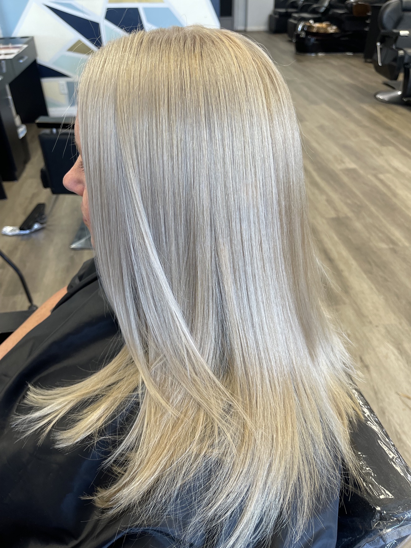 Straight platinum blonde hair, side view, by Heather at D&H Hair Company