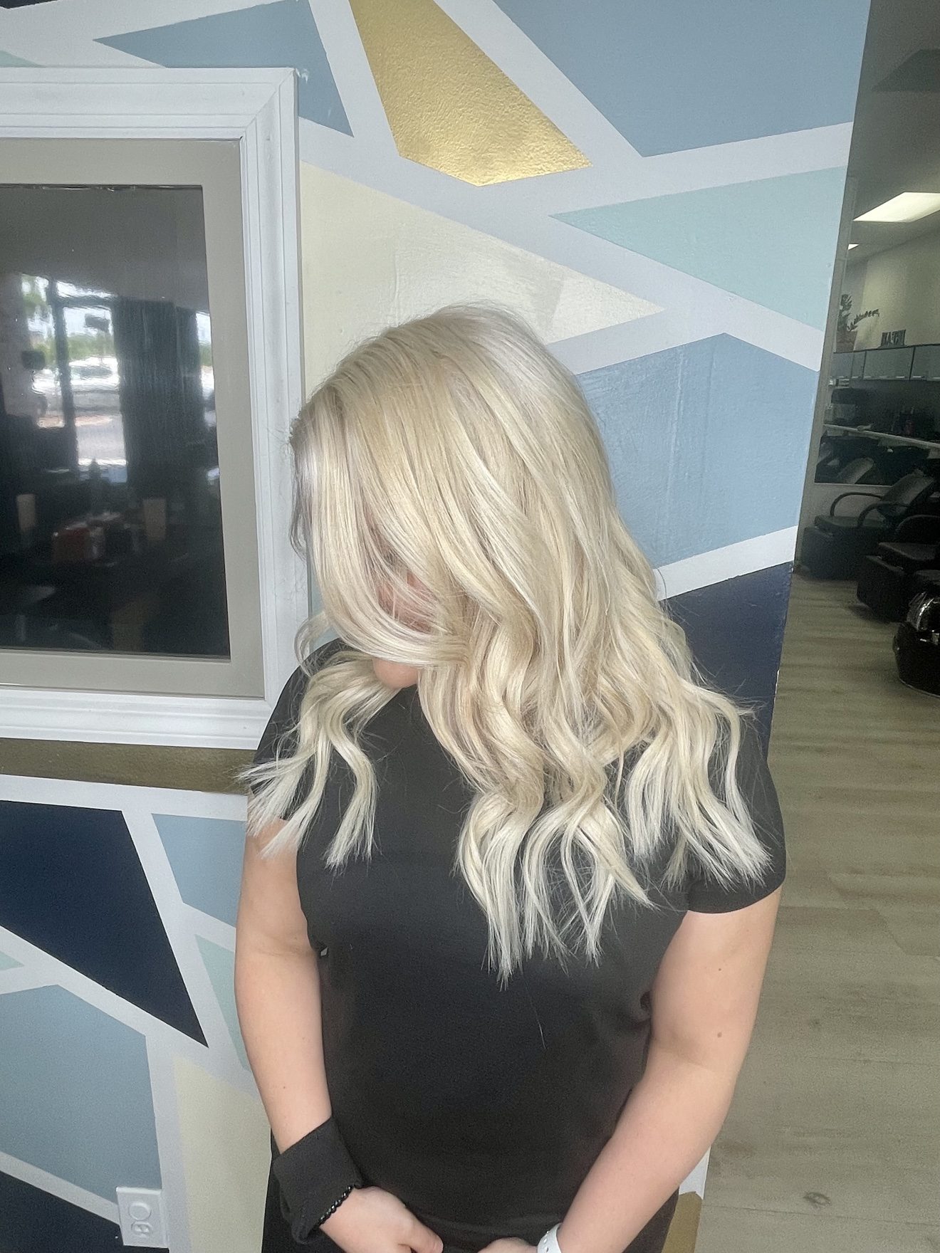 Platinum blonde wavy hair extensions, side view, by Heather at D&H Hair Company