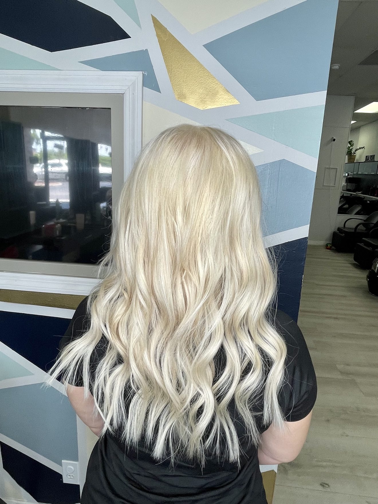 Platinum blonde wavy hair extensions, back view, by Heather at D&H Hair Company