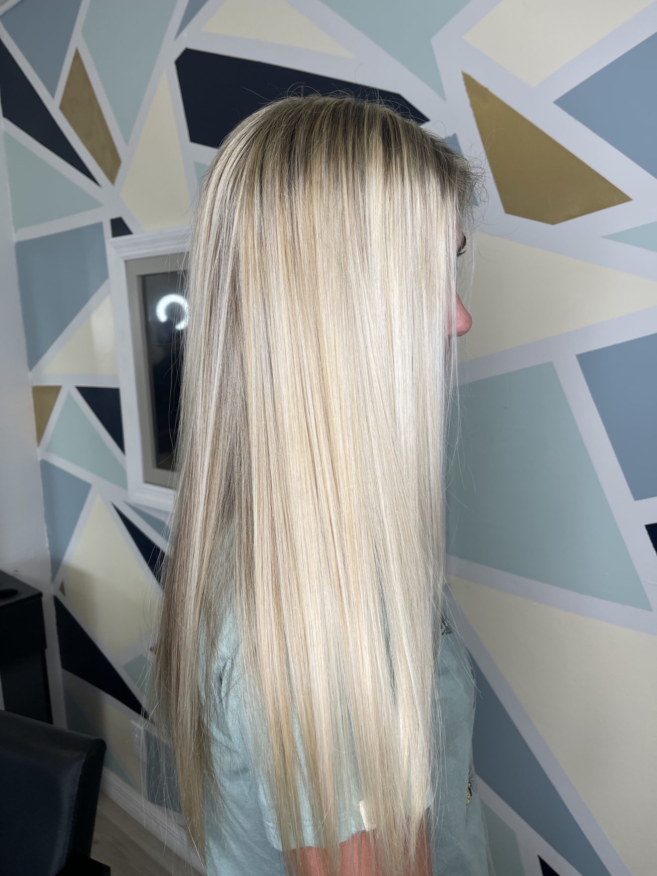 Long straight platinum blonde hair, side view, by Heather at D&H Hair Company