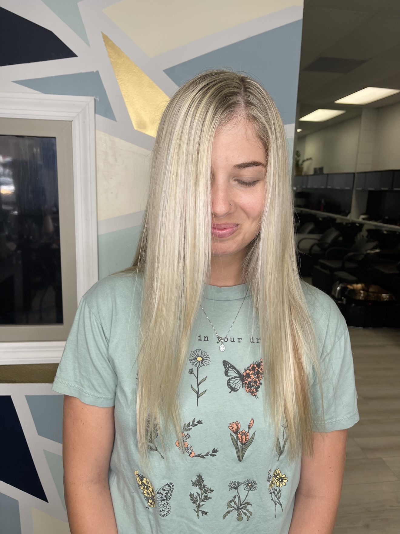 Long straight platinum blonde hair, front view, by Heather at D&H Hair Company