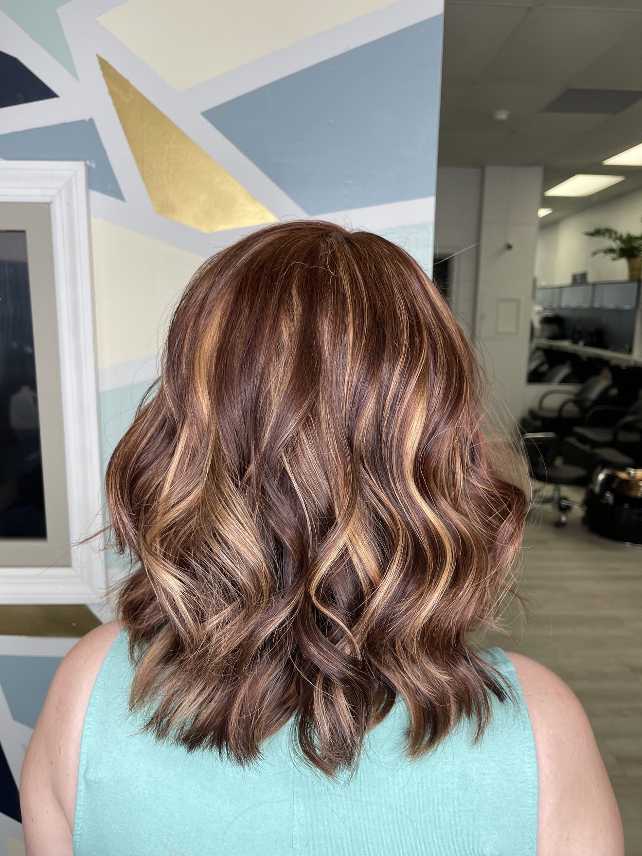 Red hair with golden highlights, back view, by Heather at D&H Hair Company