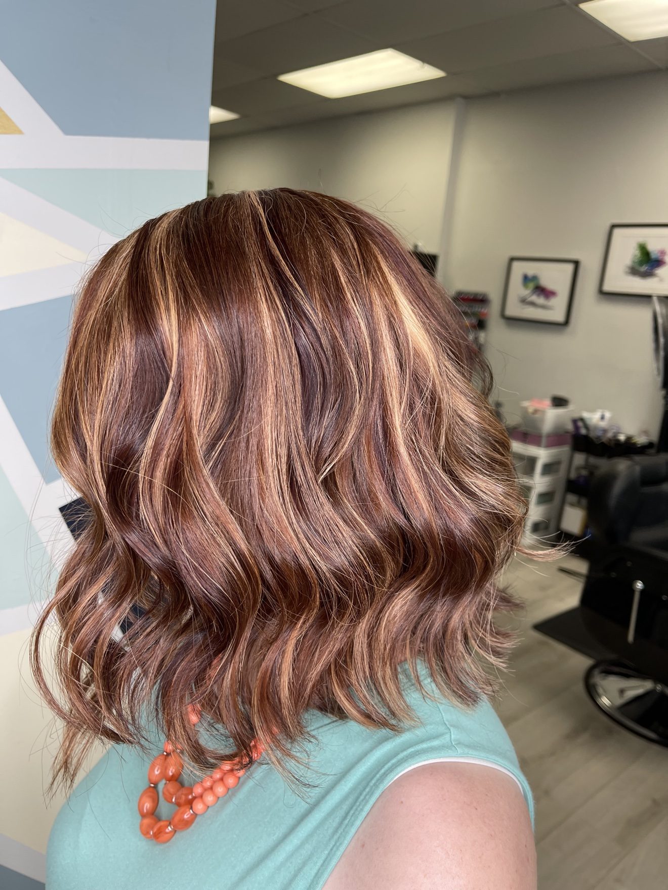 Red hair with golden highlights, side view, by Heather at D&H Hair Company