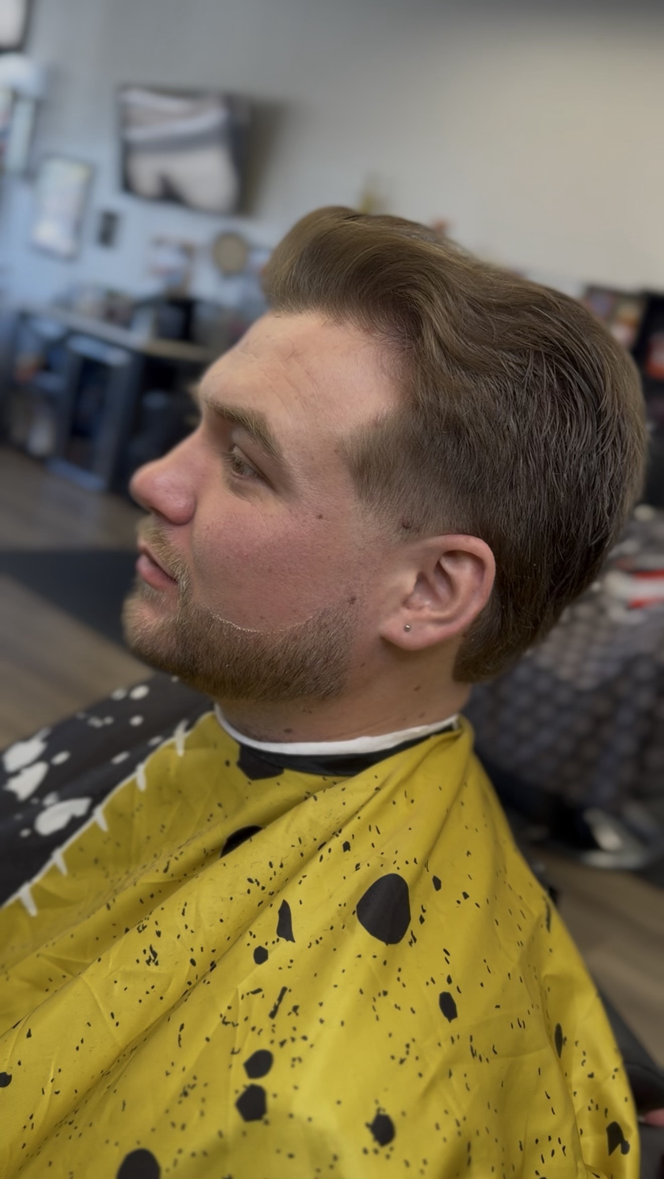 Classic side-part haircut with a beard lineup, side view, by Jacob at D&H Hair Company