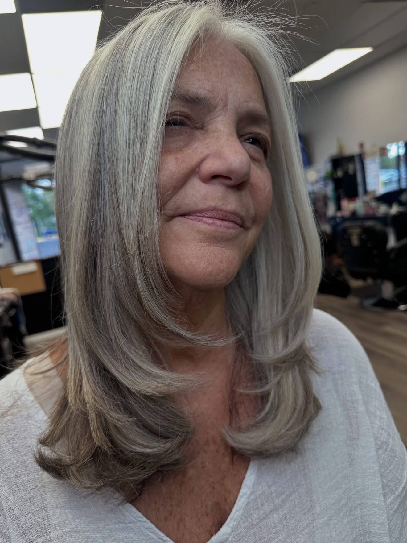 Silver grey layered cut, front view, by Lauren at D&H Hair Company