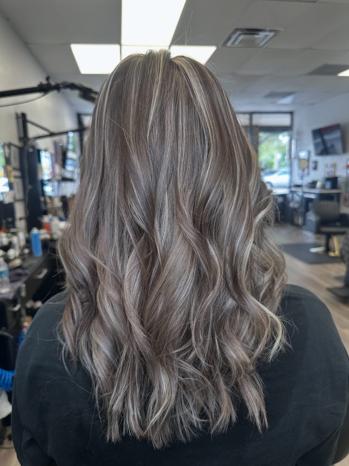 Ash dimensional color with soft waves, back view, by Lauren at D&H Hair Company