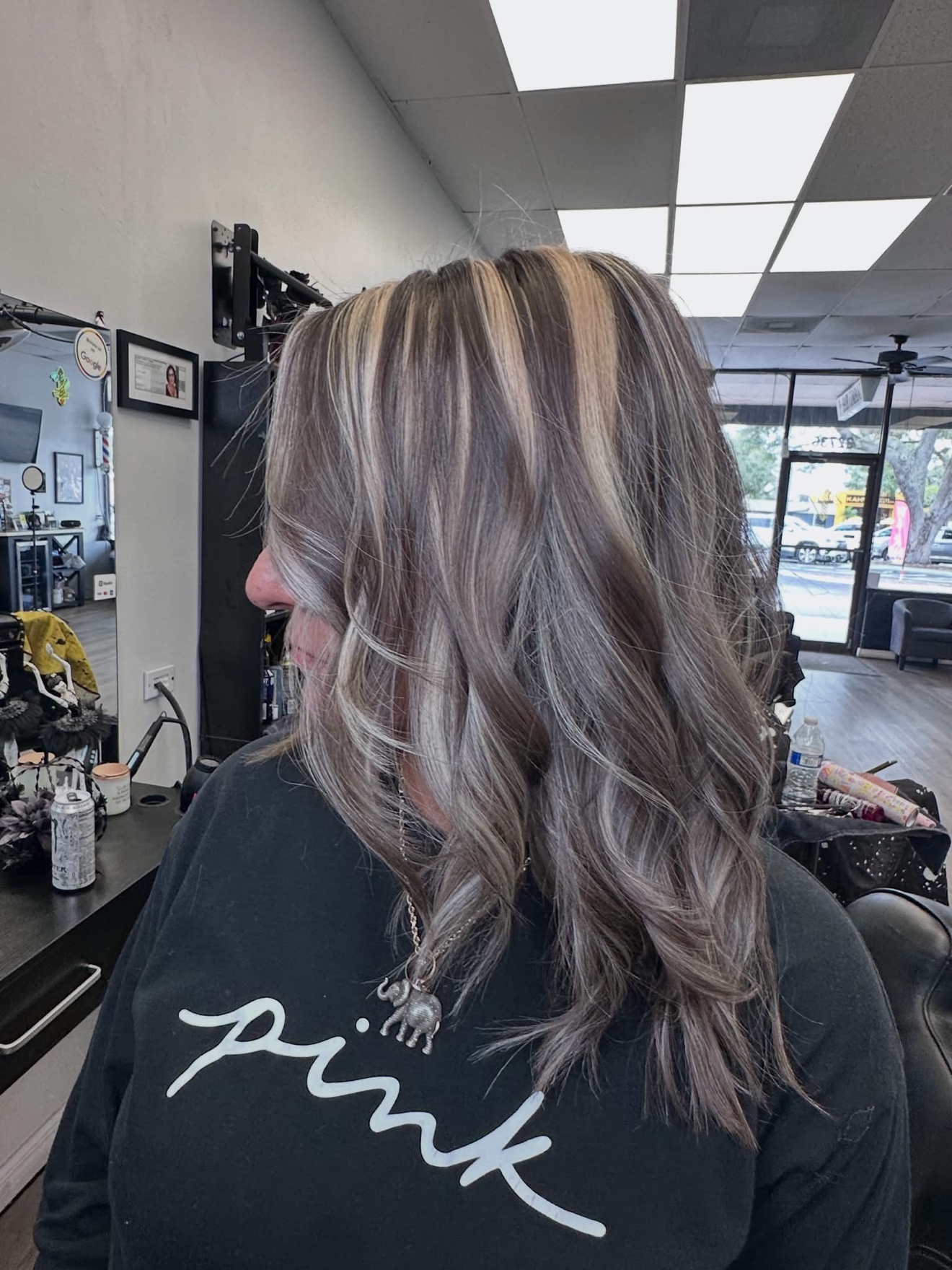 Ash dimensional color with soft waves, side view, by Lauren at D&H Hair Company