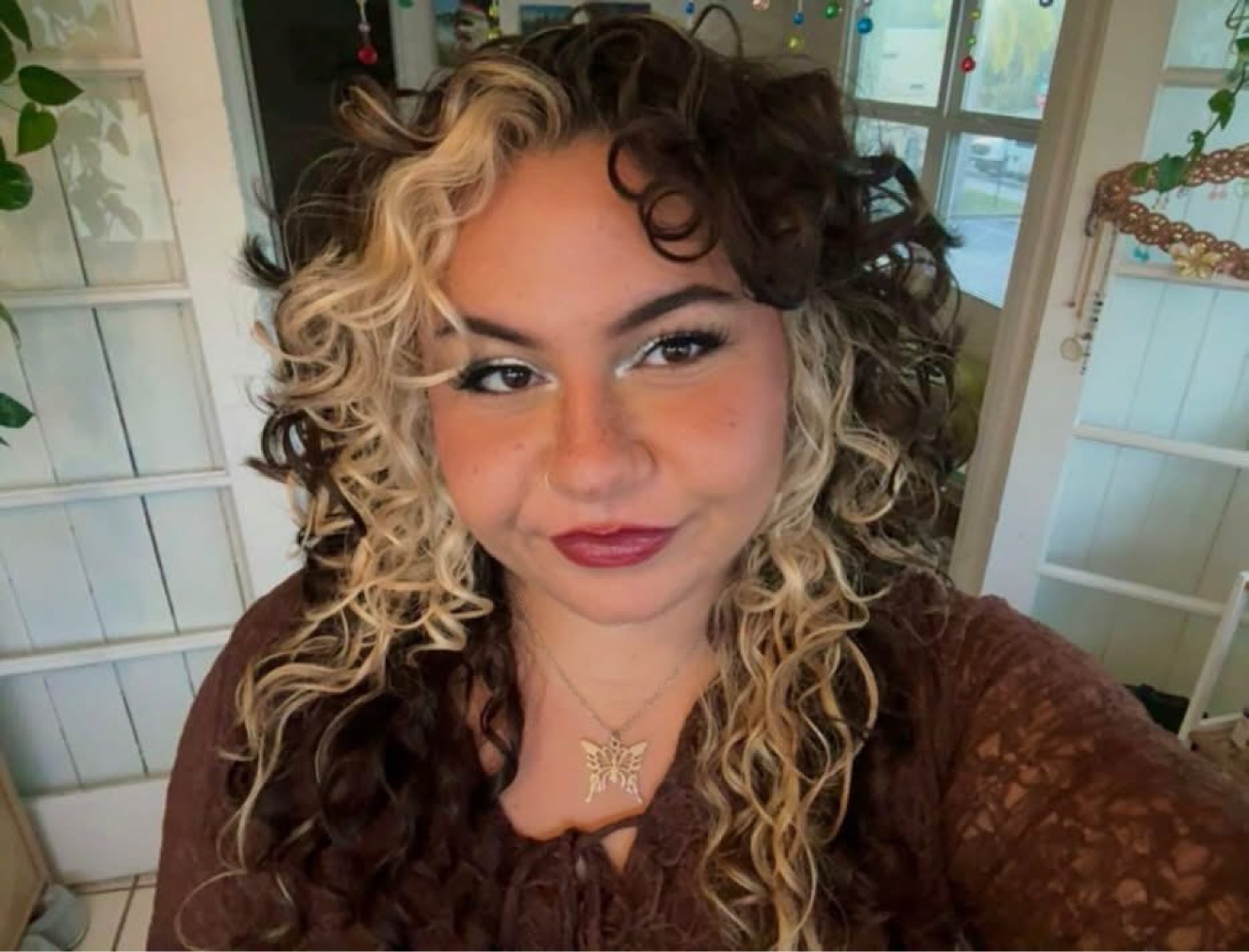 Two-tone curly blonde and brown hair, front view, by Lauren at D&H Hair Company