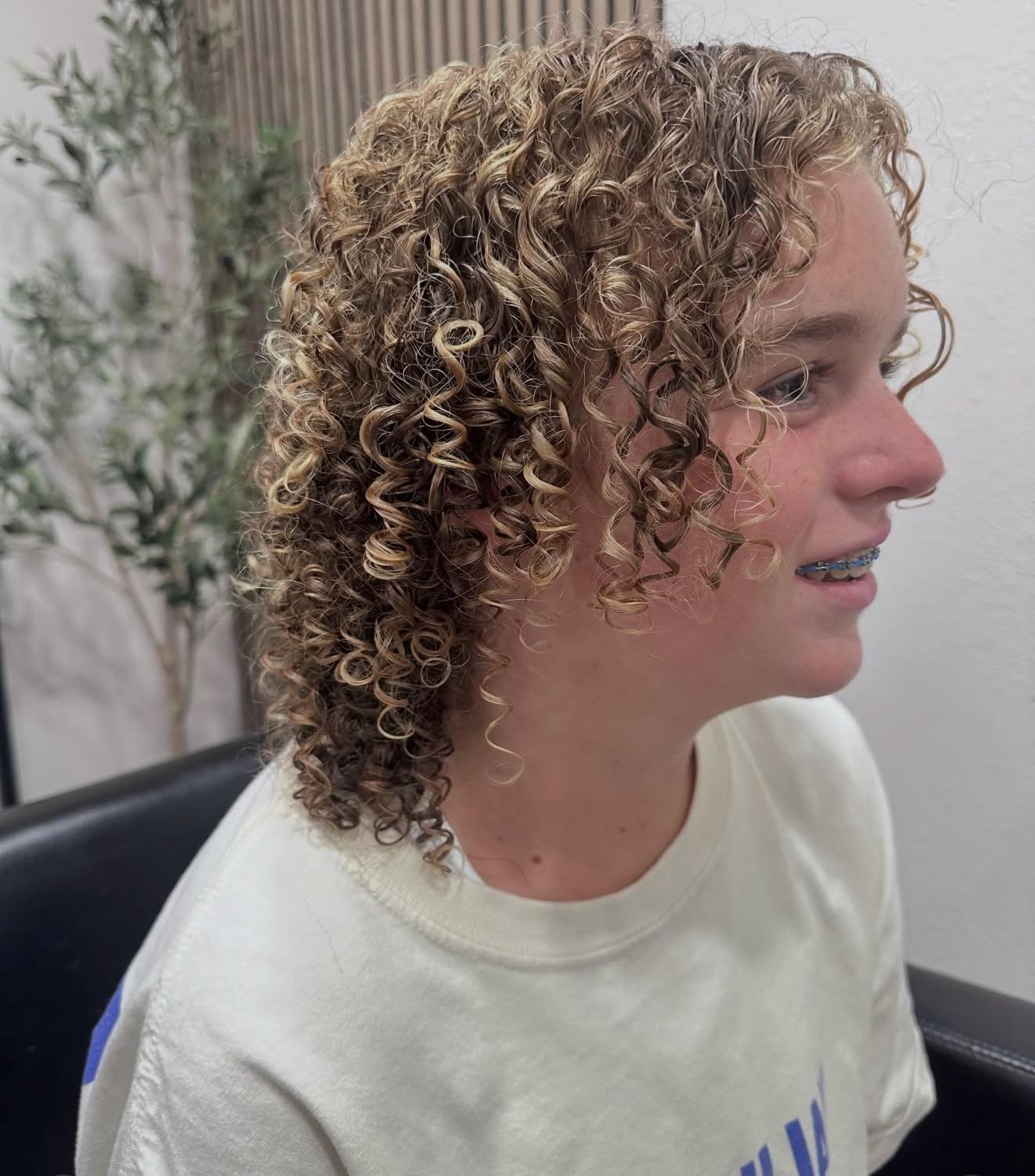 Blonde and brown curl cut, side view, by Lauren at D&H Hair Company