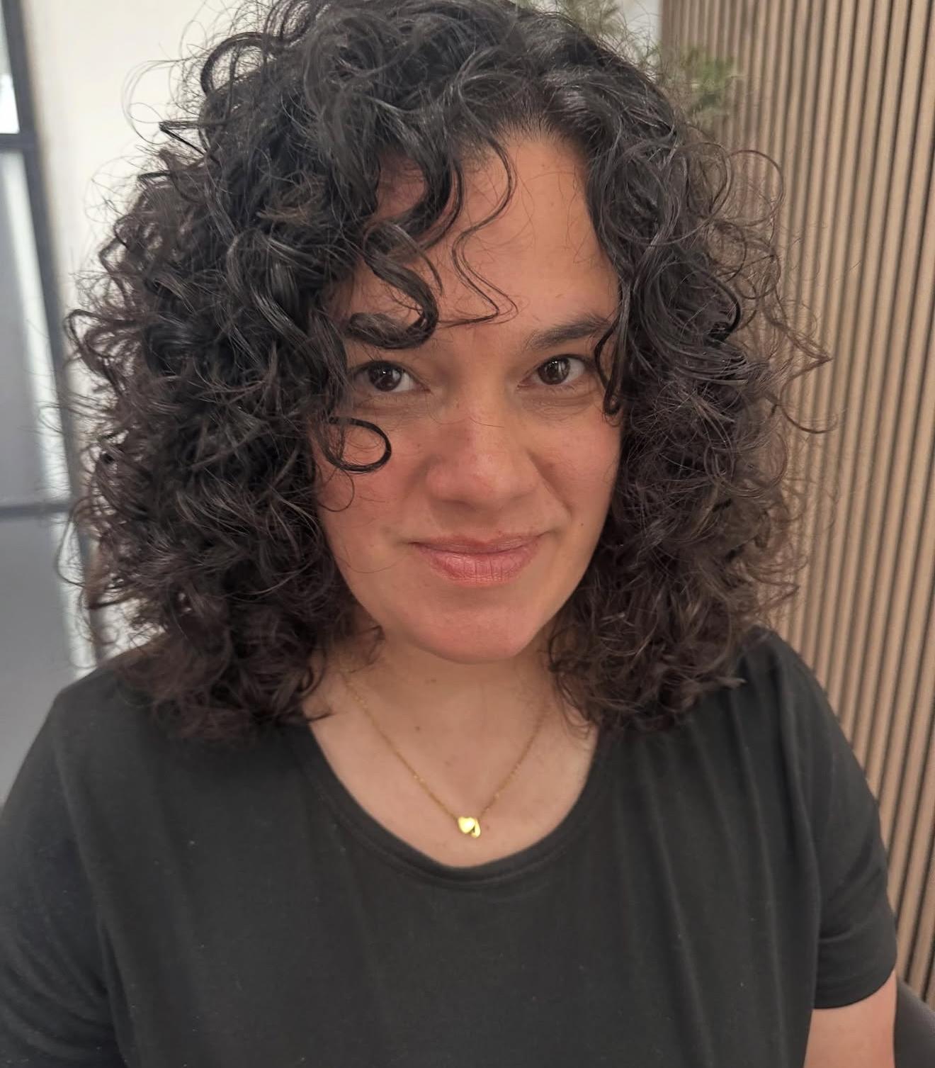 Dark curly hair, front view, by Lauren at D&H Hair Company