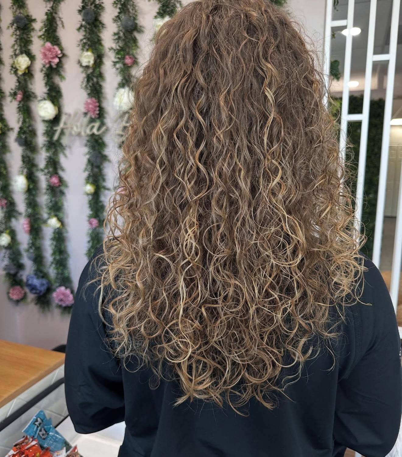 Long curly hair, back view, by Lauren at D&H Hair Company