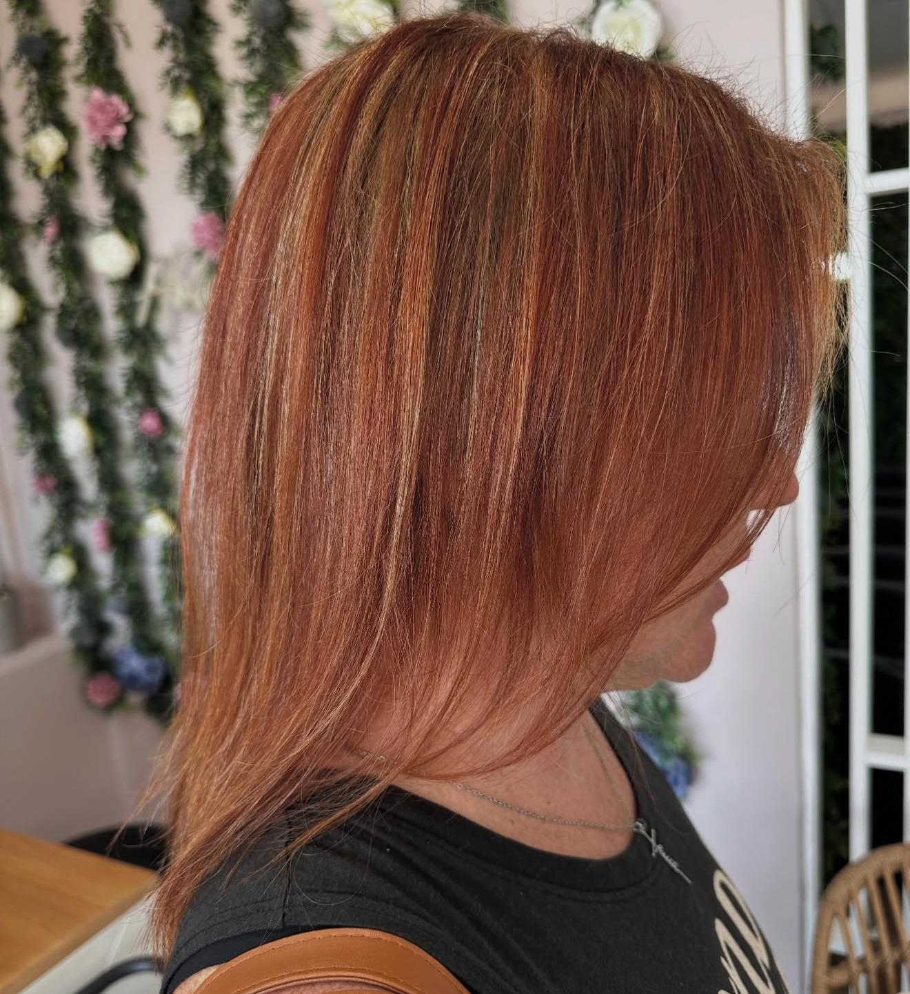 Long custom copper hair with hand-painted highlights, side view, by Lauren at D&H Hair Company