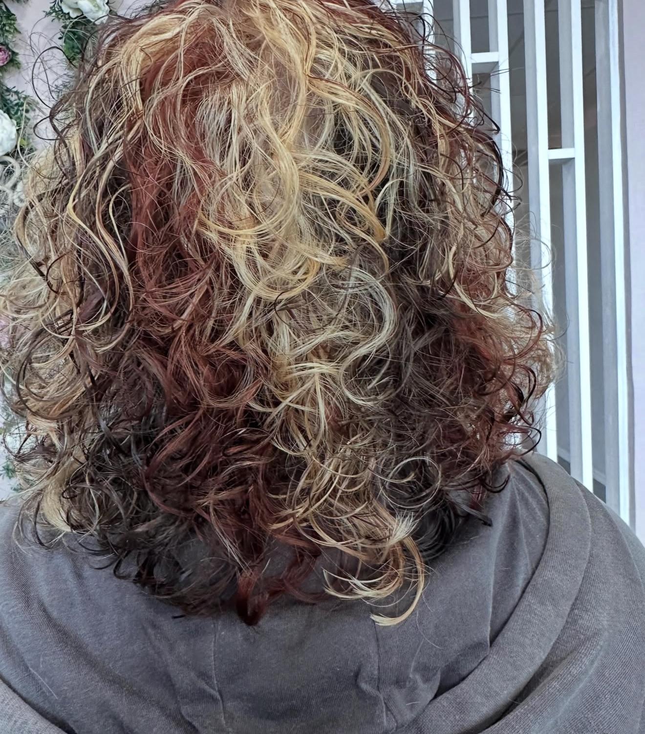 Calico curls in blonde, red and brown, back view, by Lauren at D&H Hair Company
