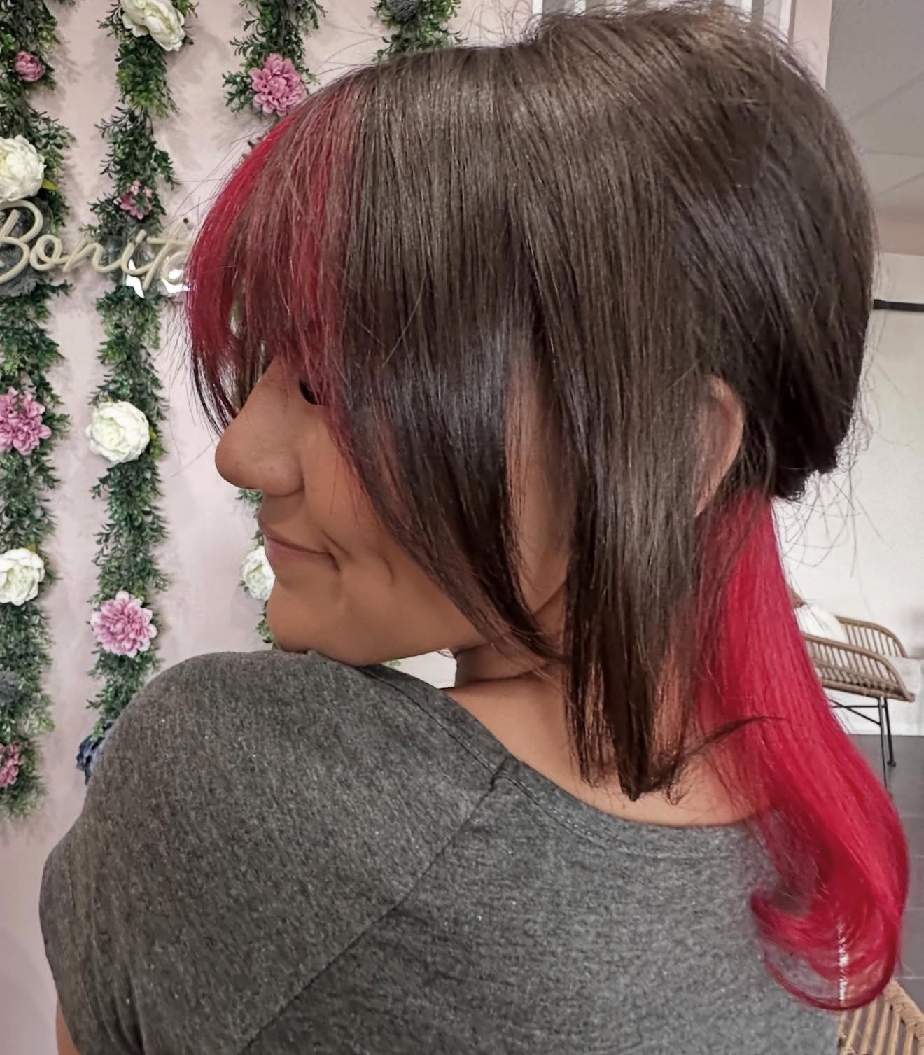 Dark hair with fire red peekaboo color, side view, by Lauren at D&H Hair Company