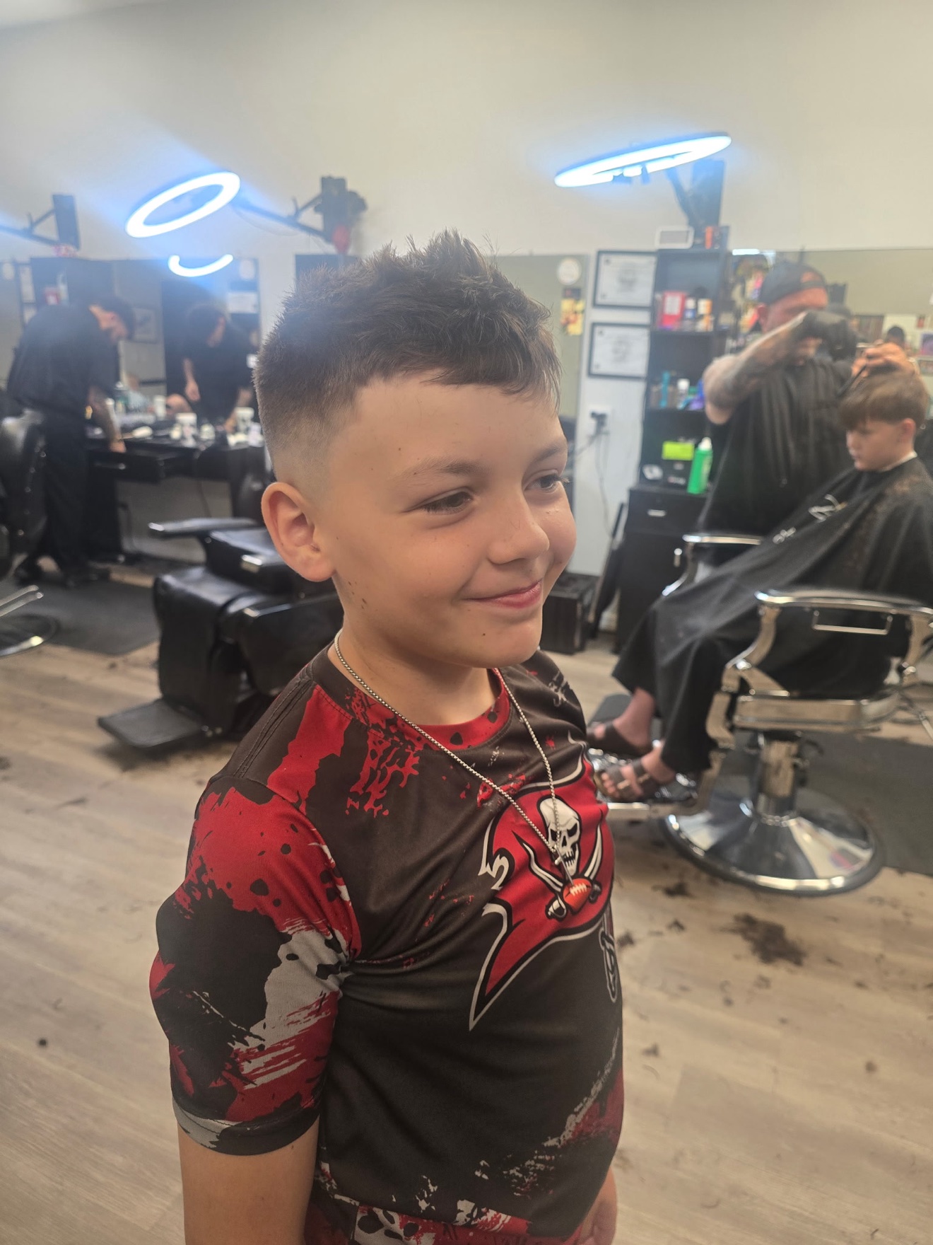 Kid&rsquo;s cut with a textured top and fade, by Rae at D&H Hair Company