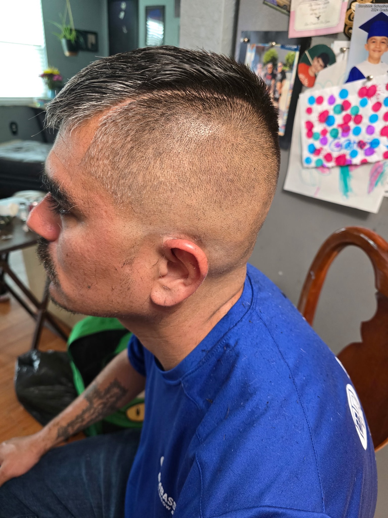 High skin fade with a hard part, side view, by Rae at D&H Hair Company